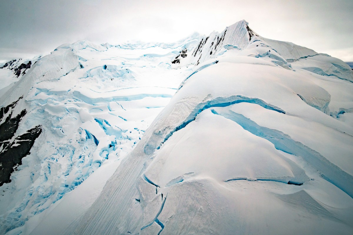 Crevasses illuminated with icy blue light in Paradise Bay, Antarctica