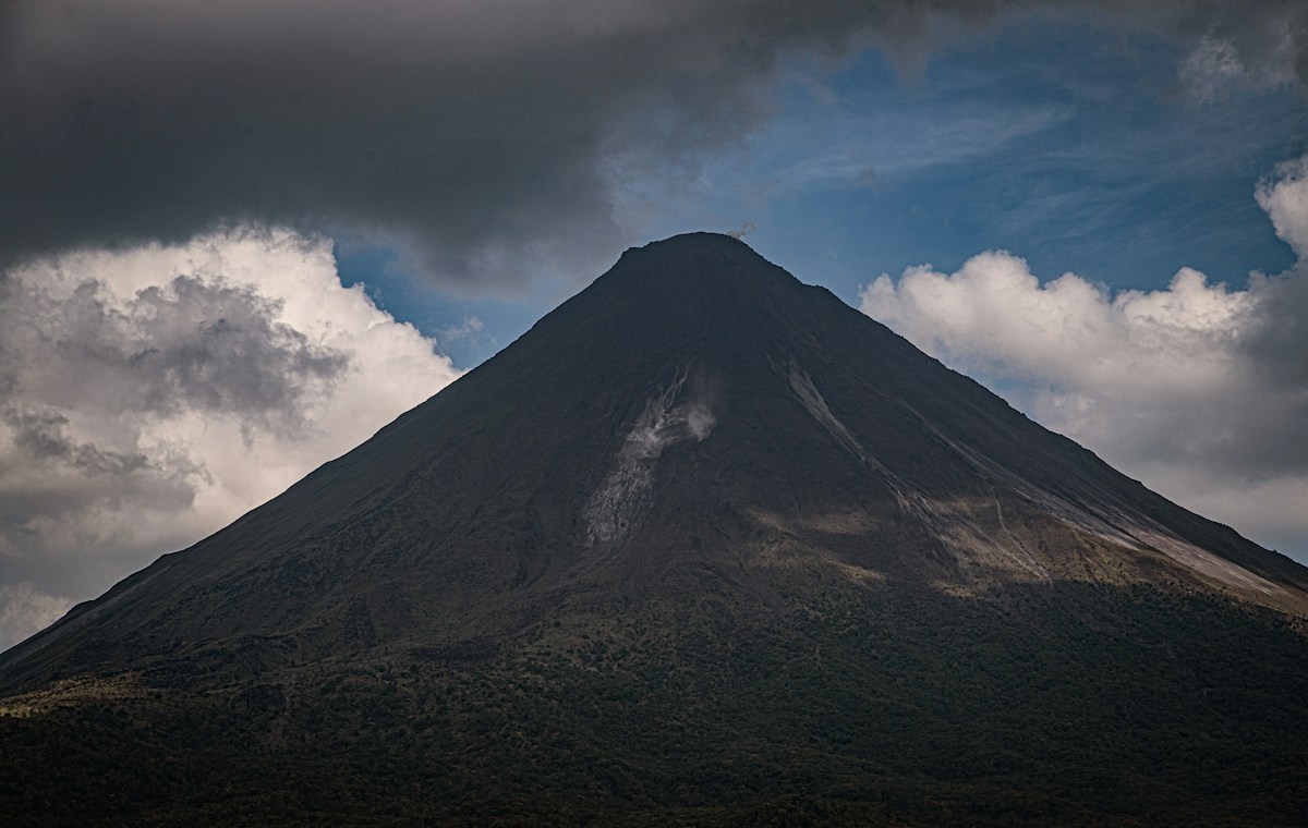 Arenal Volcano under a cloudy sky in Costa Rica